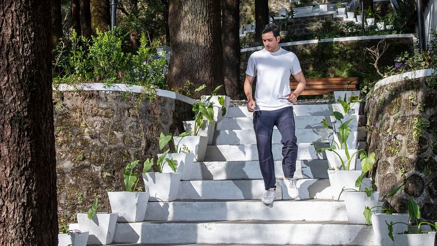 image of a man climbing down white stairs
