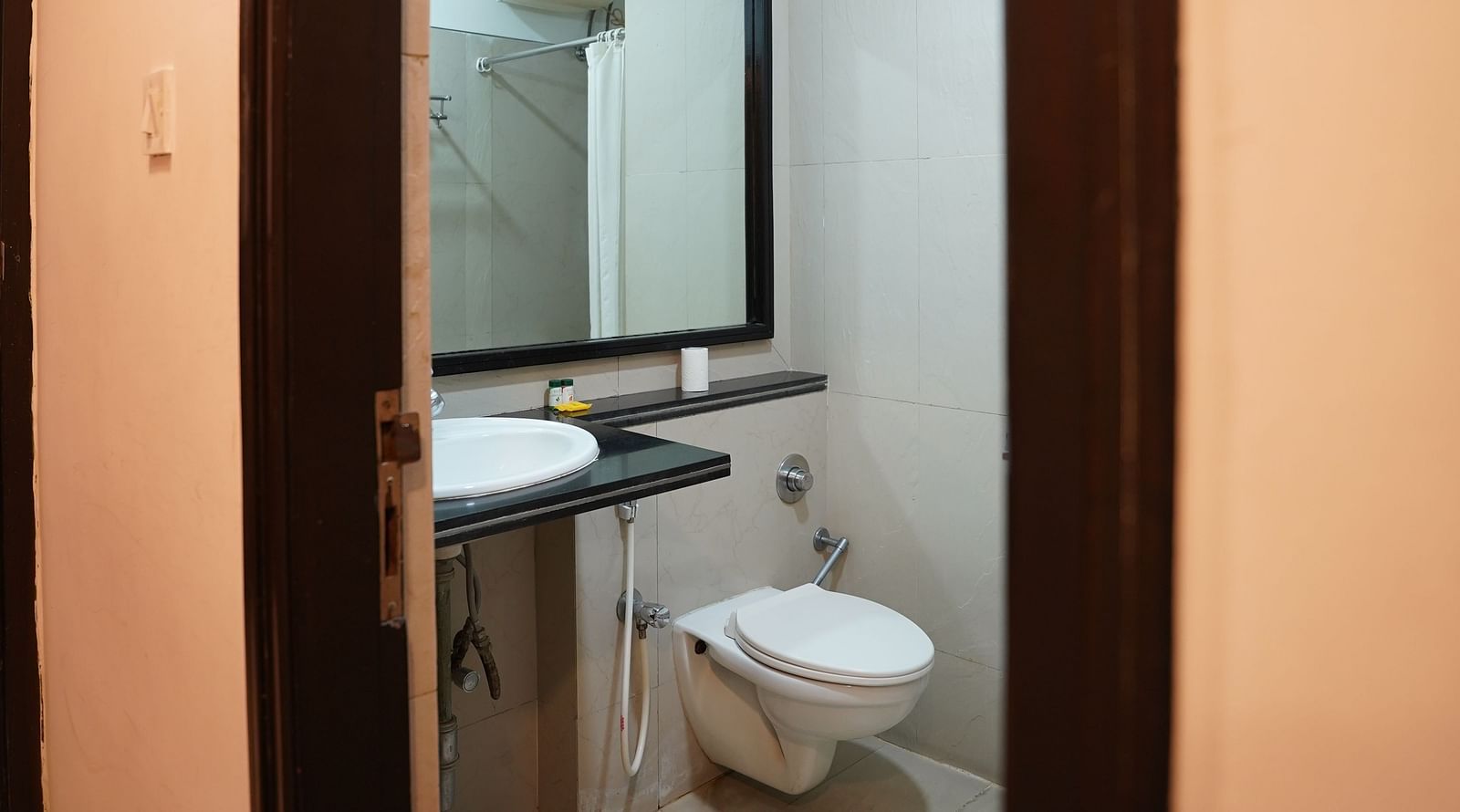 an image of a bathroom with a mirror at  City Centre Residency, Bangalore