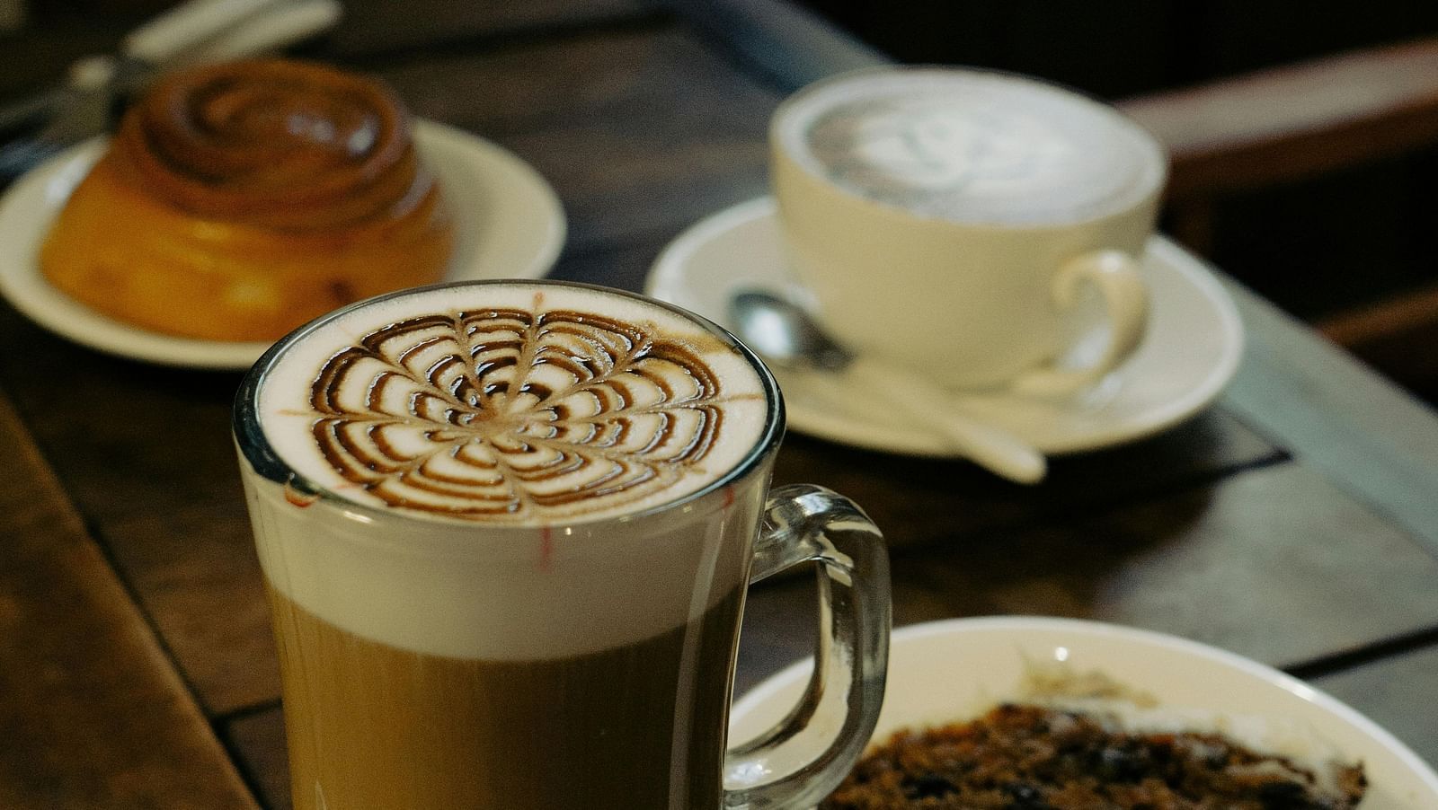 Close-up of Coffees and Cakes Standing on a Table in a Cafe