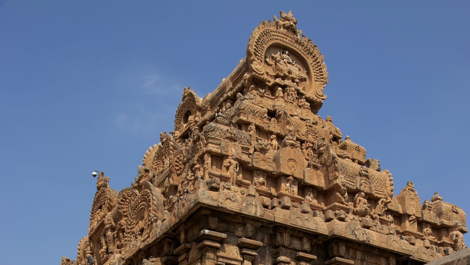 Ancient stone temple with intricate carvings and weathered architecture.