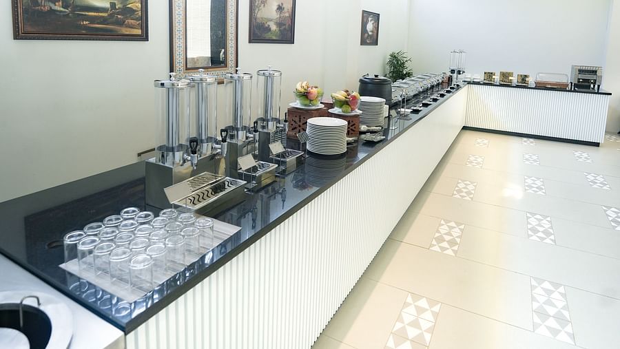 An image of a buffet area at our restaurant in Bankahandi with neatly arranged cutlery on the counter - NAMAMI BY ZENQ BANKHANDI