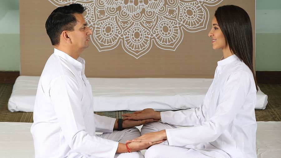 Couple meditating in manesar resorts gurgaon