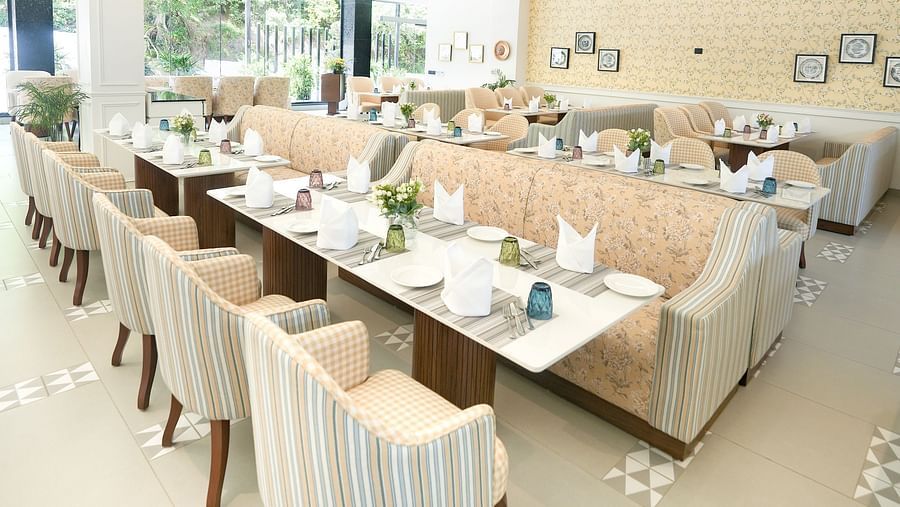 A portrait image of a restaurant with cosy furniture placed around the dining table - NAMAMI BY ZENQ BANKHANDI