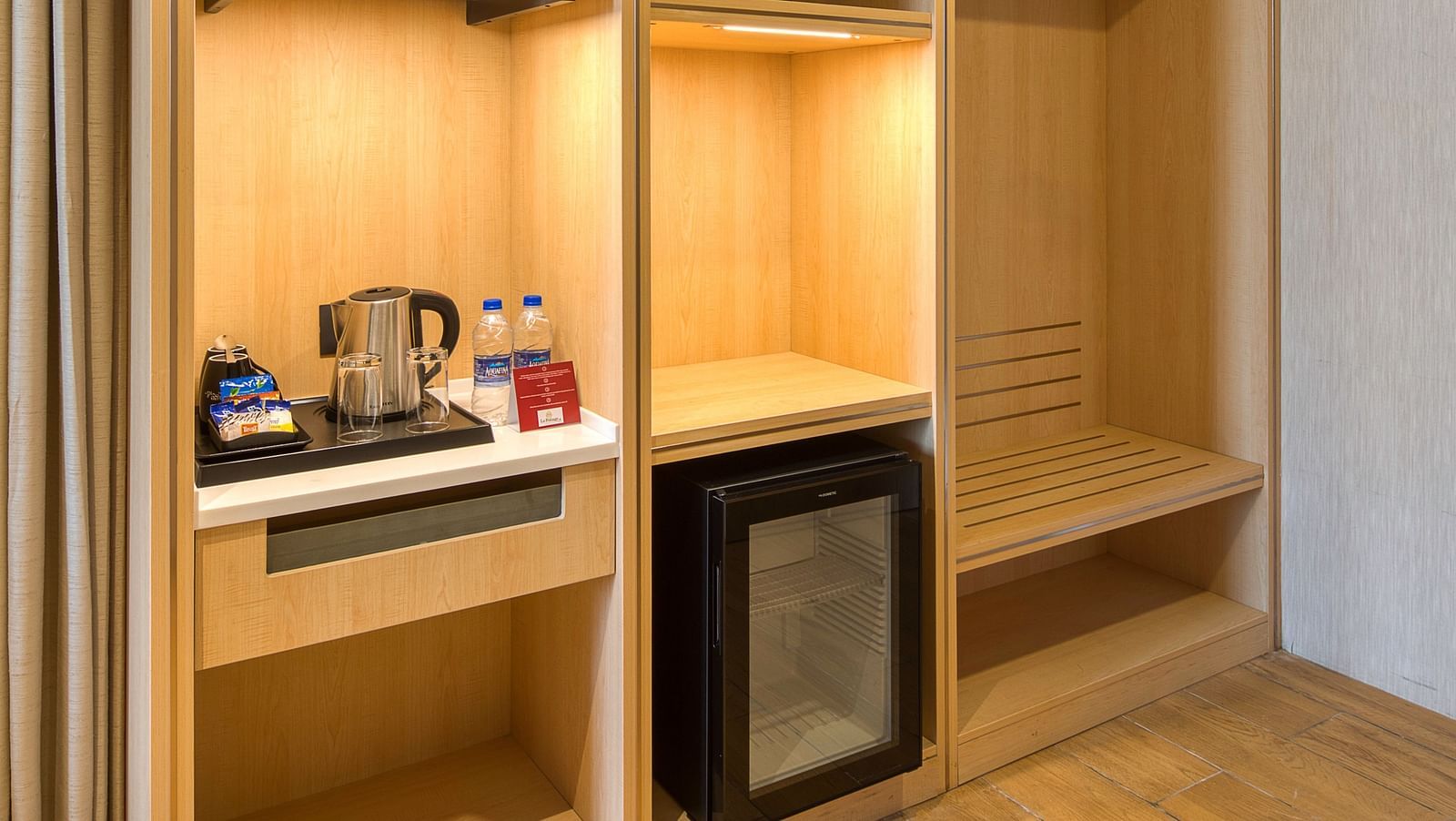 Shelf with the minibar at Sumo Suite at Le Foliage by TGI, Bangalore