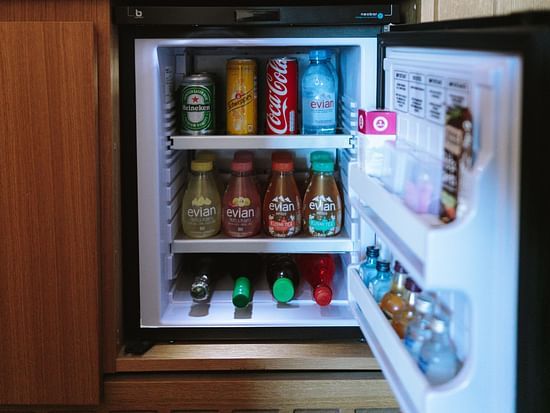 The mini-bar with drinks inside