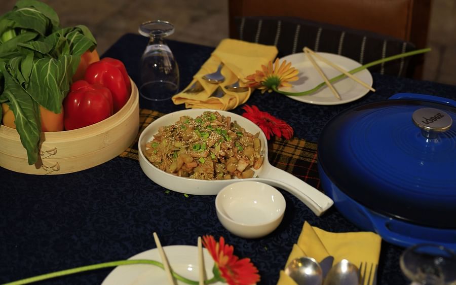 An image of various dishes placed on a dining table by the poolside - Polo Orchid Resort, Cherrapunji