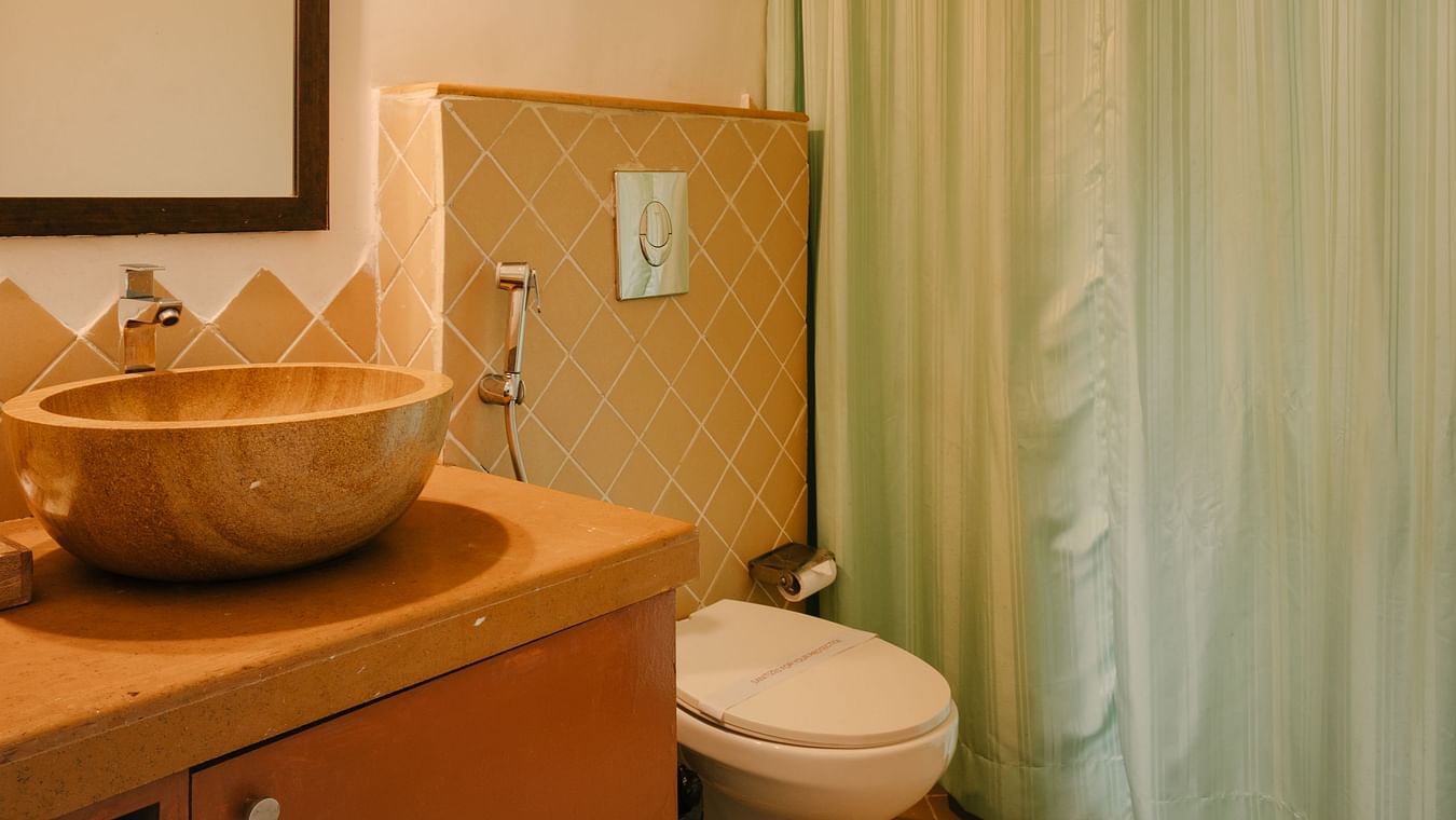 Well-lit bathroom with stylish interiors at One BHK Apartment, Richmonde Ananta Elite, Goa.