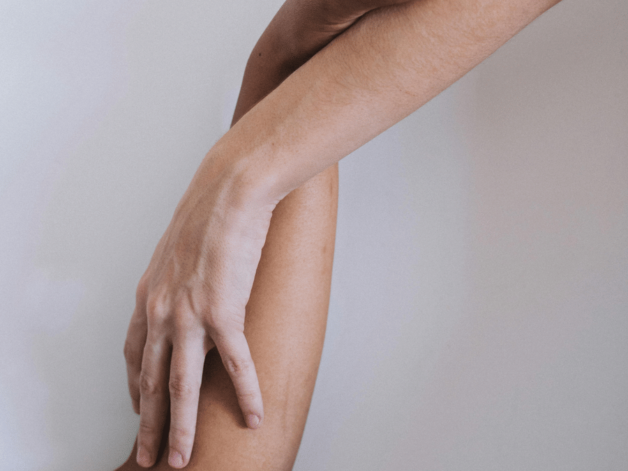 Two hands holding each other