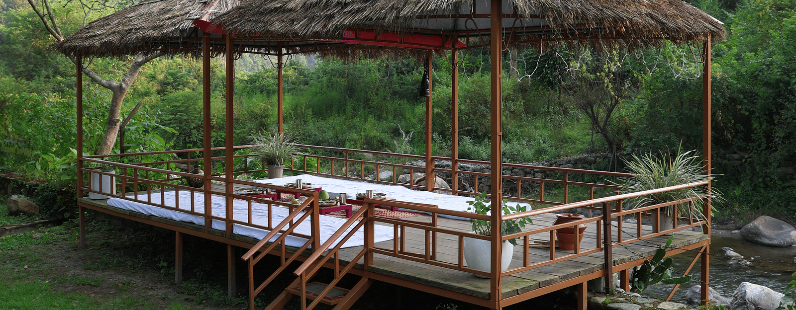 Exterior view of a dining setup in an open-air setting at the Sylvan Retreat, Dehradun.