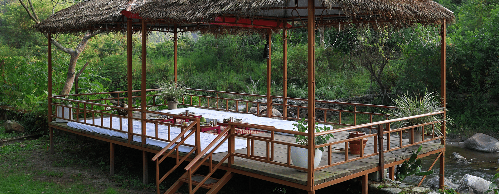 Exterior view of a dining setup in an open-air setting at the Sylvan Retreat, Dehradun.