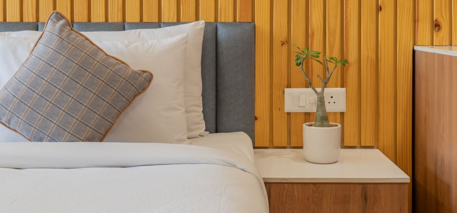A deluxe room with a half view of the bed and a coffee table at Hotel Highway King, Bagru