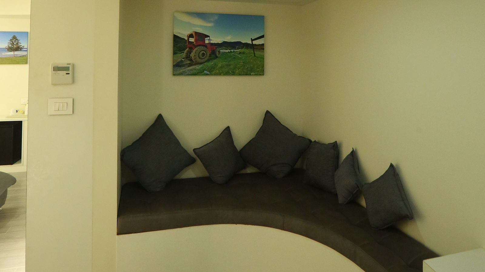 Club Suite interior with a seating area, and curved wall design - TGI SPS Grand, Coimbatore
