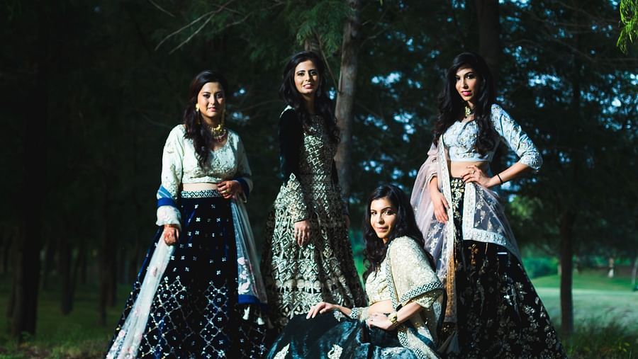 Four women posing for a picture in the outdoors in front of a tree - Karma Lakelands.