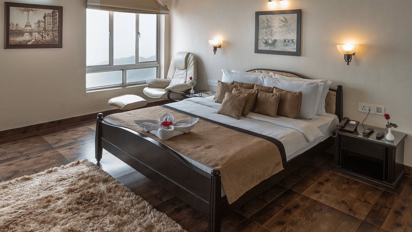 Rustic attic bedroom with beams