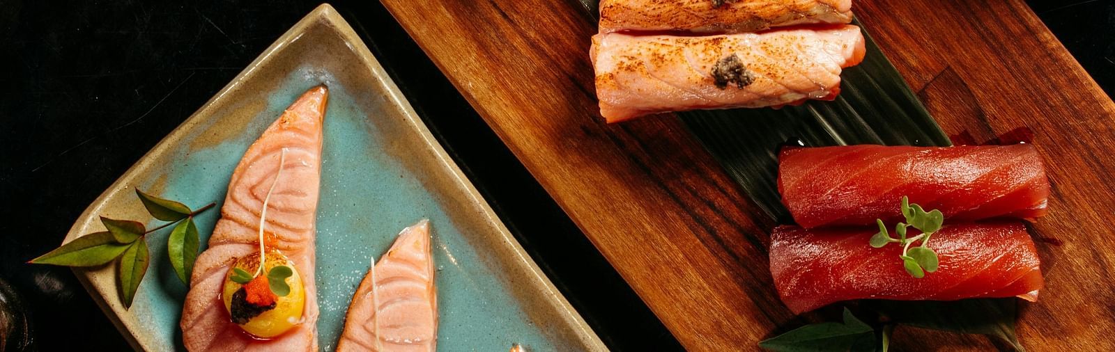 top angle shot of a sushi platter served with soy sauce