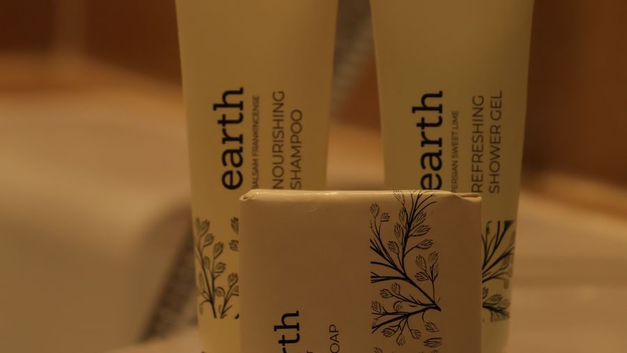 Bathroom supplies which includes a soap, shampoo, and a showeer gel