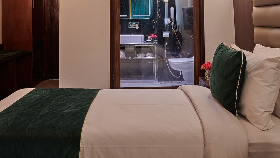An image of the executive room with a pristine washroom - Deventure Sarovar Portico, Patel Nagar