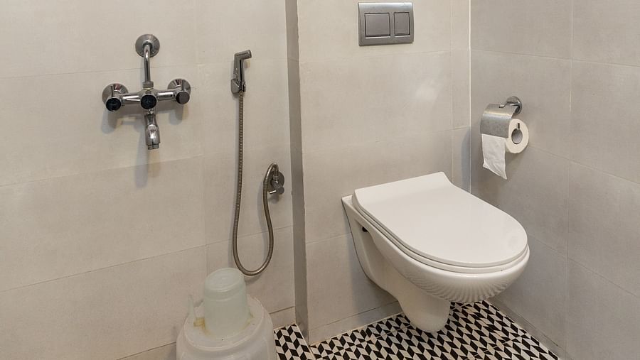 Bath area and commode at one of the rooms - Capitol Village Resort, Madikeri
