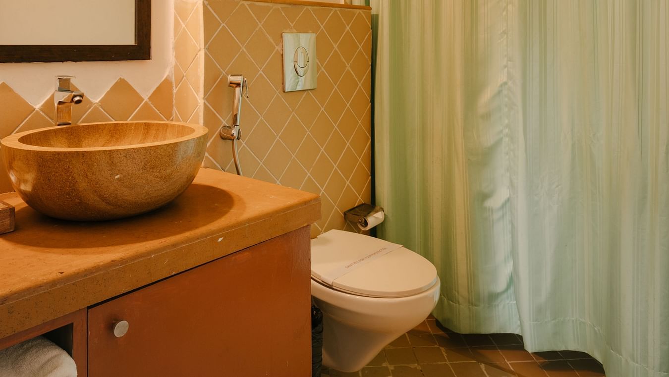 Well-lit bathroom with stylish interiors at One BHK Apartment, Richmonde Ananta Elite, Goa.