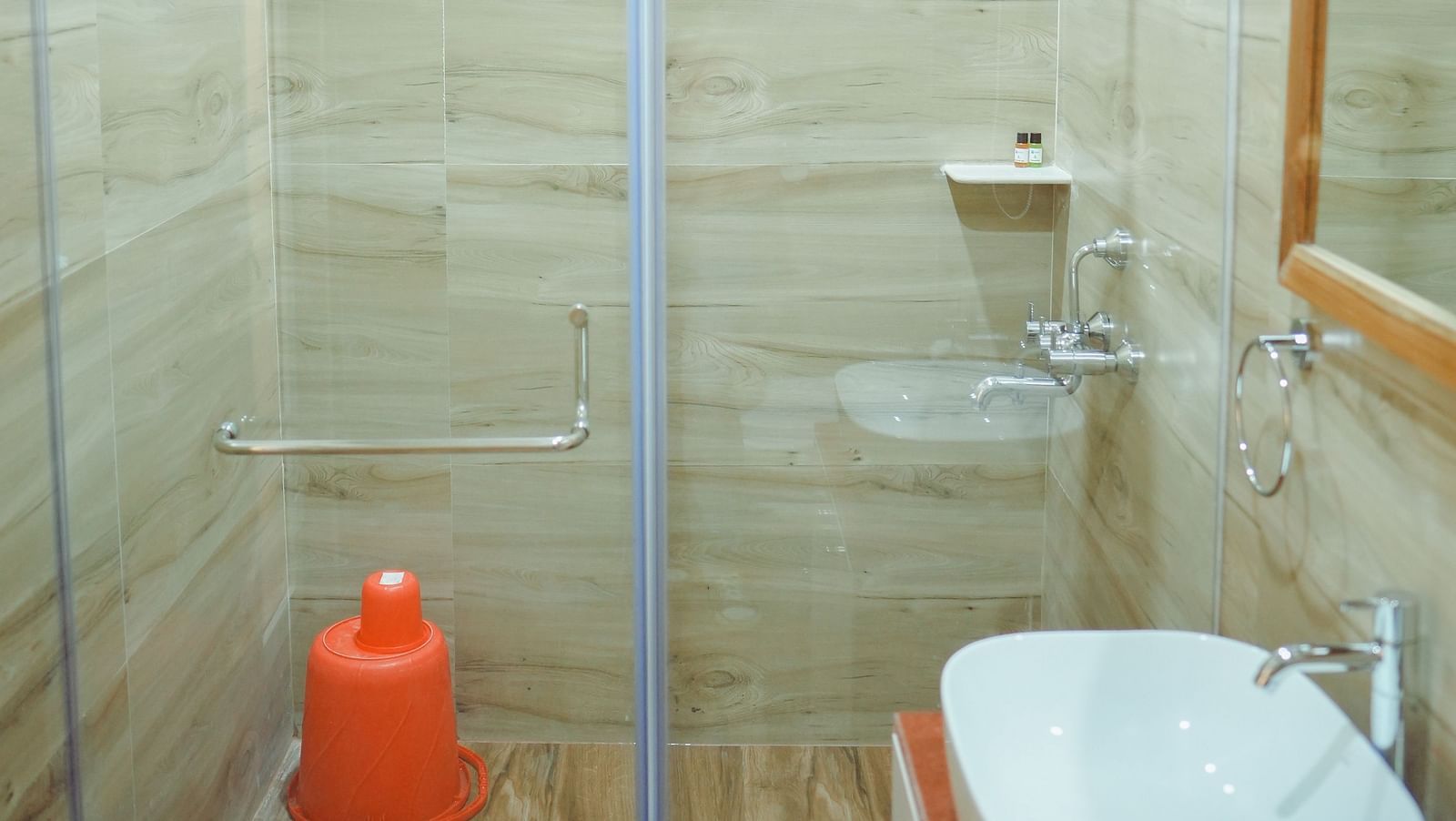 image of a spacious shower cubical with transparent glass partition in the bathroom