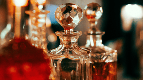 Close-up of elegant crystal glasses and candlelight creating a warm ambience - Clarks Avadh, Lucknow