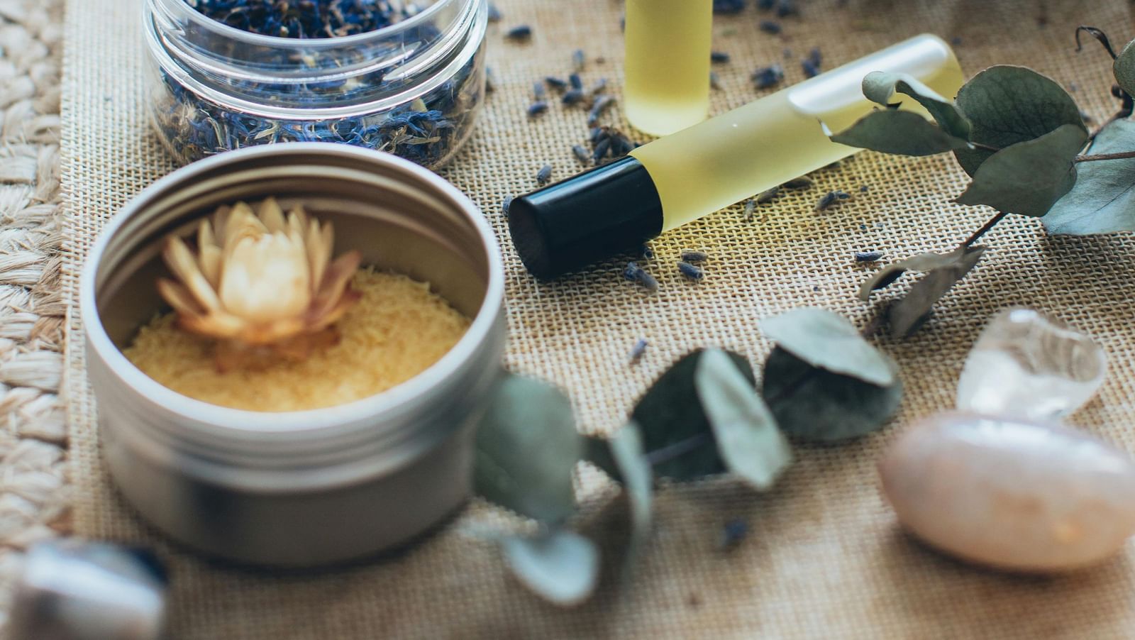A beautiful arrangement of various small bottles, containers for essential oils and cosmetics.