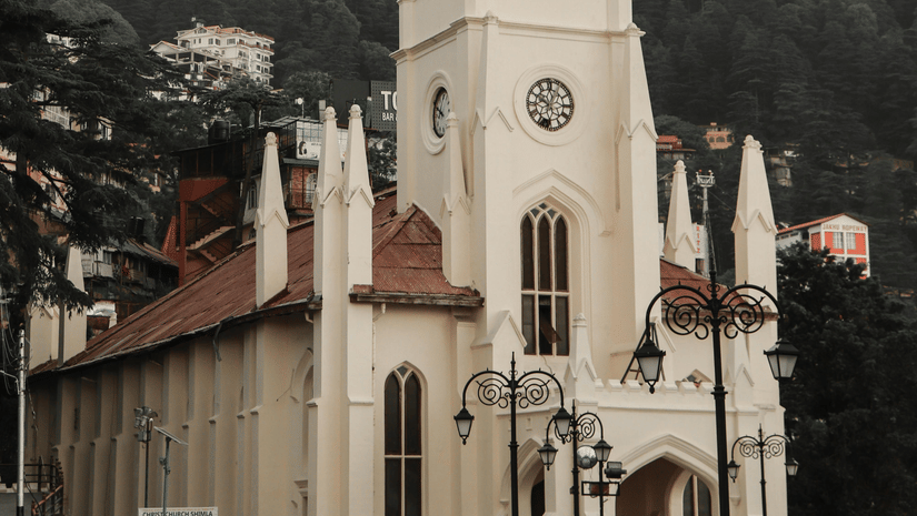 The historic Christ Church in Shimla, one of the best places to visit in Shimla, with its pale stone tower rising above a busy pedestrian area.