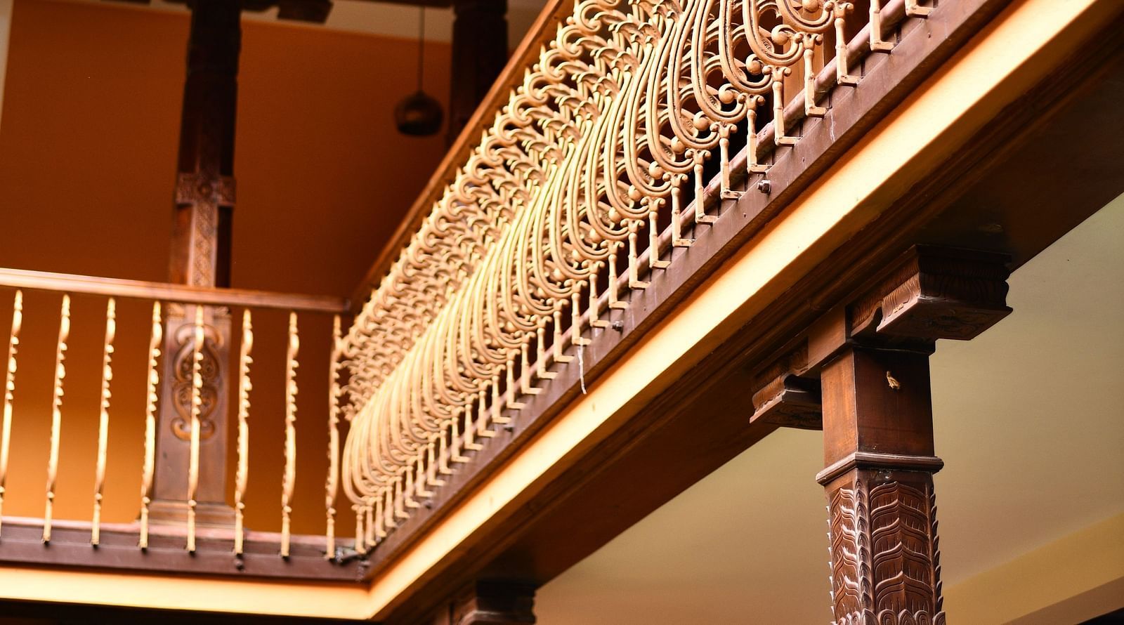 An image of a classic style wooden balcony inside the property