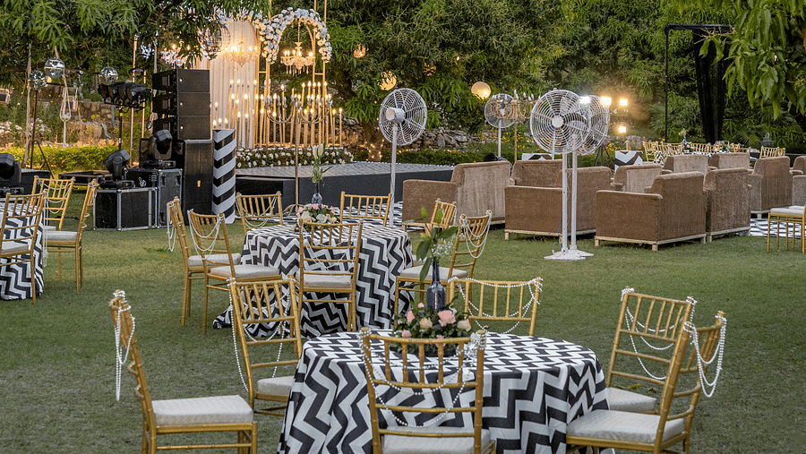 A view of a dining setup for a celebration in the lawn at The Sylvan Retreat, Dehradun.