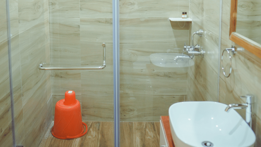 A spacious shower cubical with transparent glass partition in the bathroom of an accommodation at Dip Holidays.