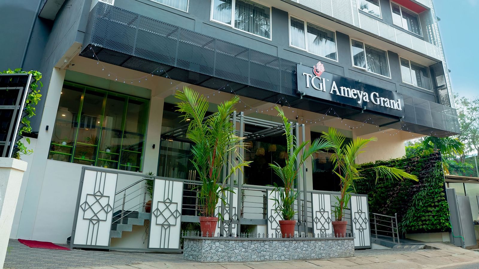 The front facade of the TGI Ameya Grand hotel in daylight - TGI Ameya Grand, Goa