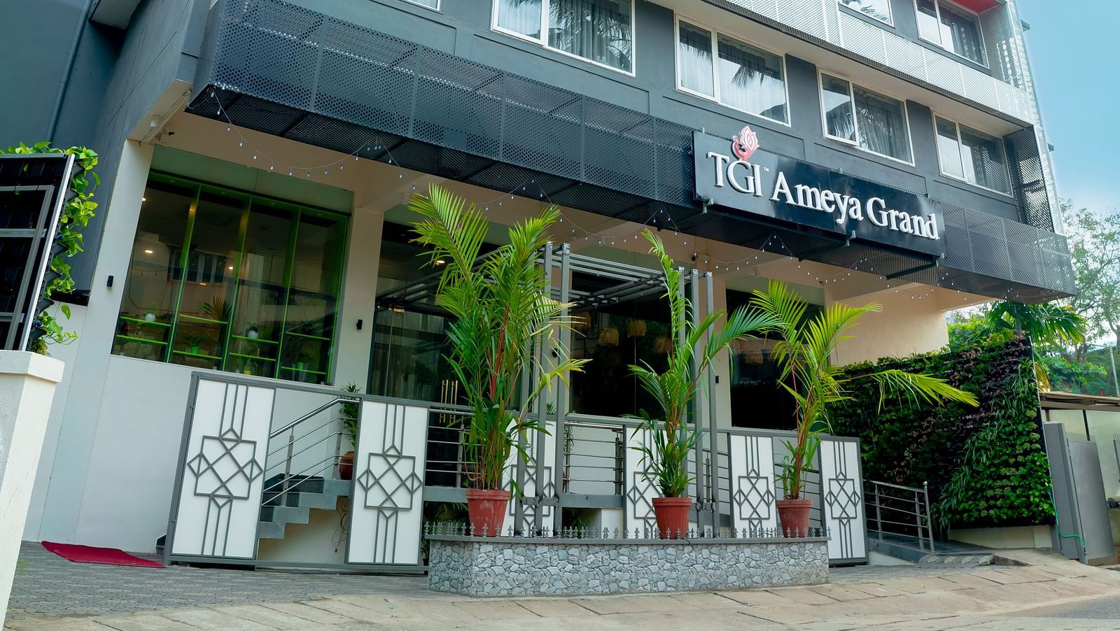 The front facade of the TGI Ameya Grand hotel in daylight - TGI Ameya Grand, Goa