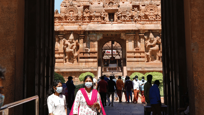 A view of the temple's main tower is framed perfectly through an archway entrance.