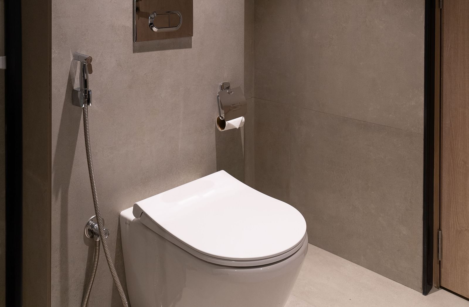 Small, modern bathroom with a toilet and mirror at Nivasana Manali.