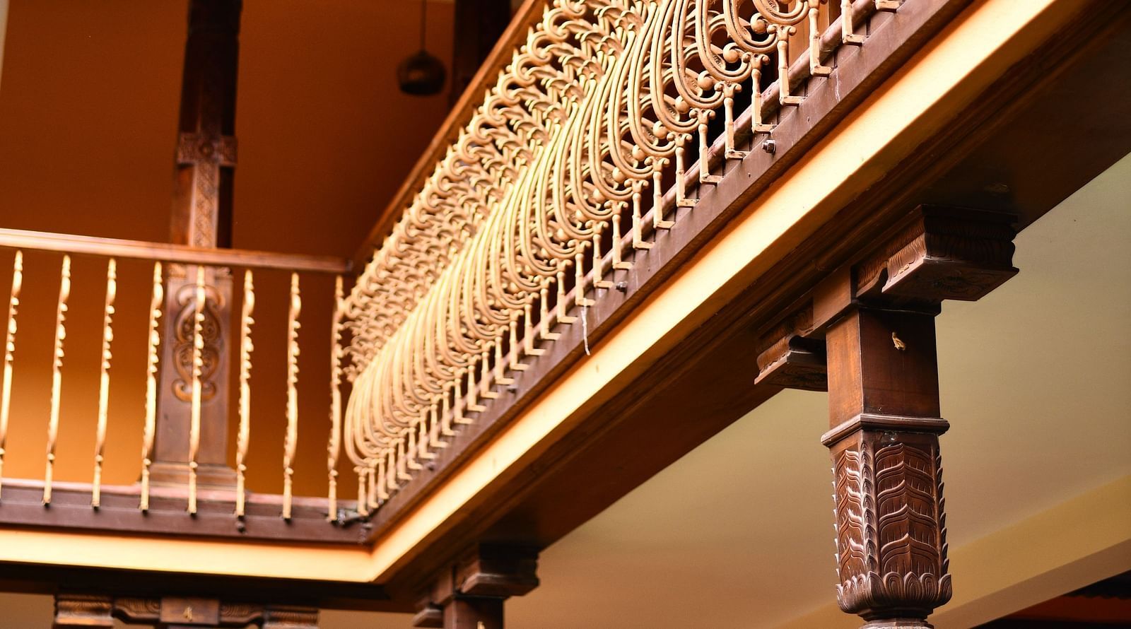 An image of a classic style wooden balcony inside the property