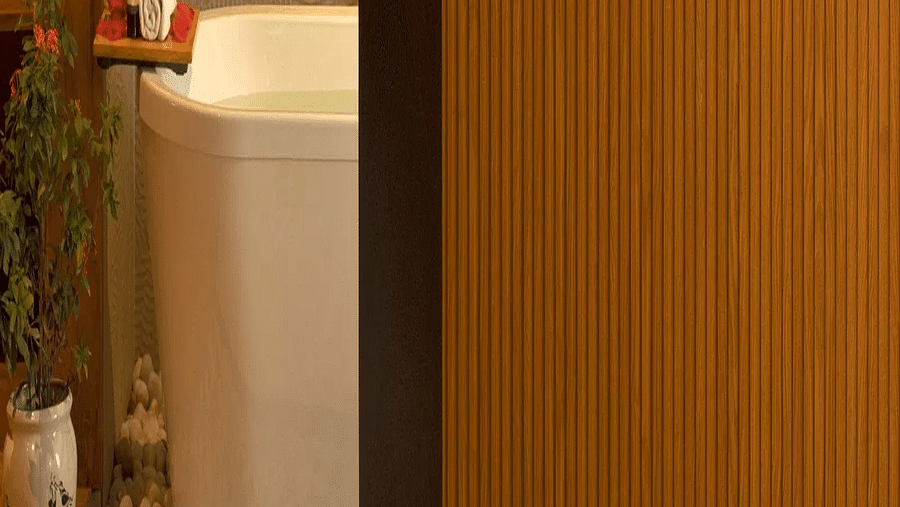 A glimpse of the battub from the bedroom of the Coral Teal Suite at Coral Reef Resort and Spa in Havelock