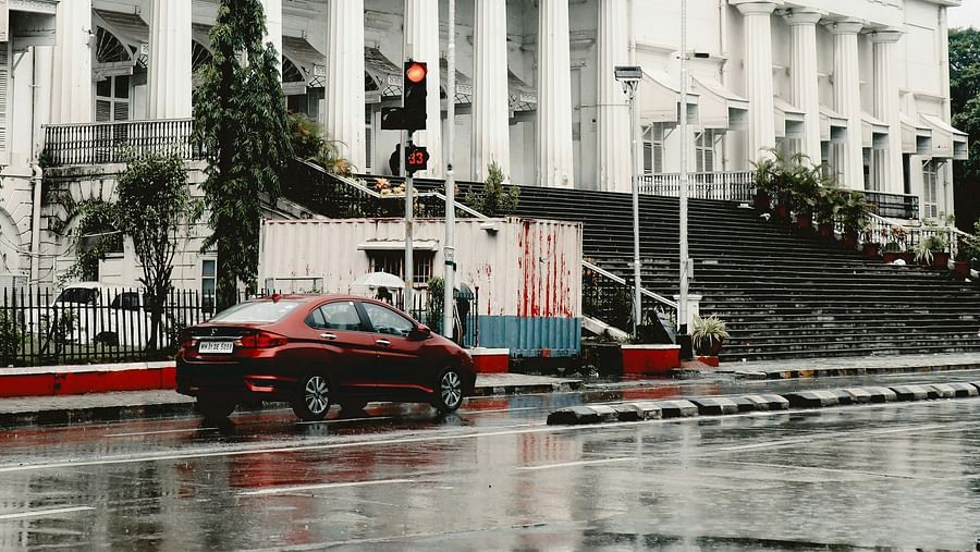 A road during monsoon  in front of a government building