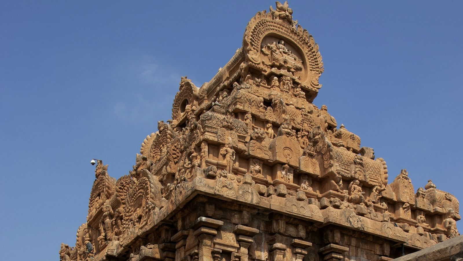 Ancient stone temple with intricate carvings and weathered architecture.