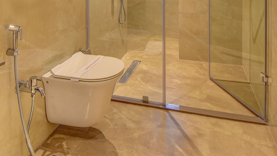 Washroom of a room at The SSK Solitaire Boutique Hotel & Spa, Gangapur Road - Nashik featuring a sink area and a mirror with warm lighting.