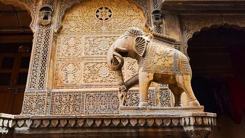 an overview of a haveli in Rajasthan with an elephants statue on the exterior