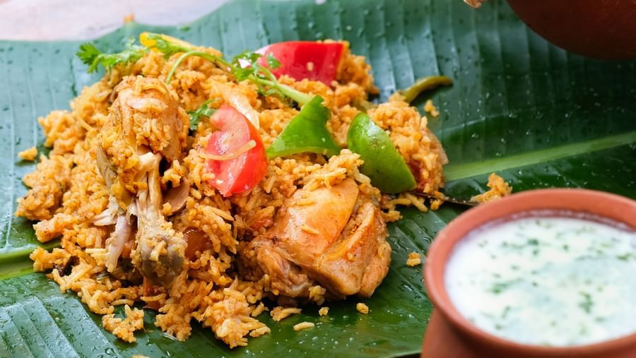 A person emptying Chattichoru to a banana leaf | Mango Hill, Pondicherry
