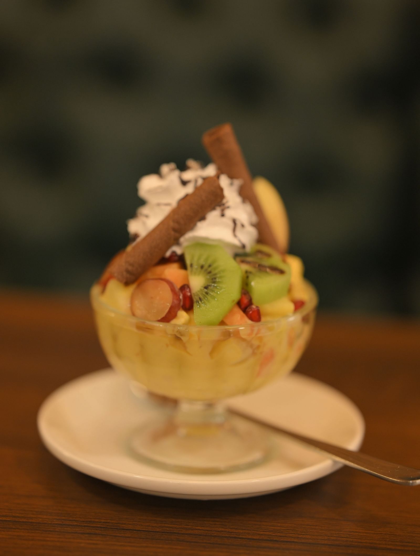 Fruit sundae with whipped cream and wafers, served at Royal Comfort Regency.
