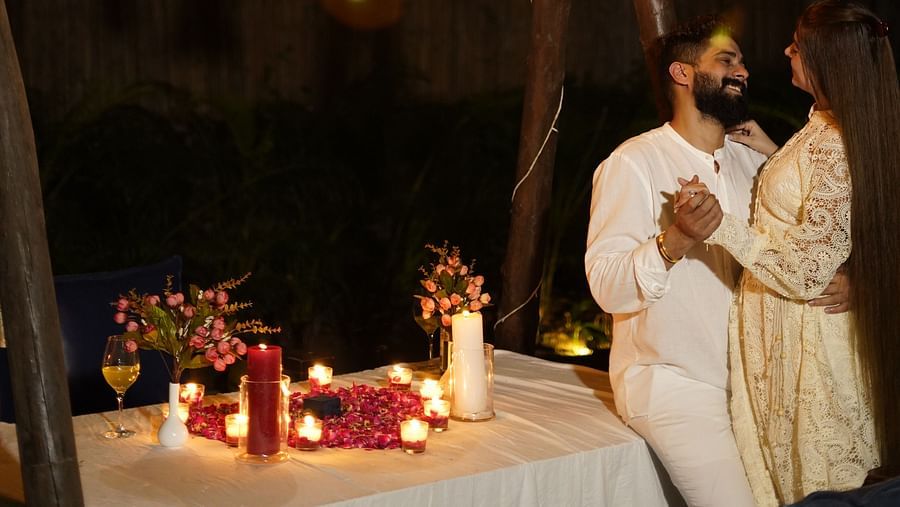 a couple enjoying candle light dinner at Themis Mudhouse - A Nature's Retreat Resort & Wellness
