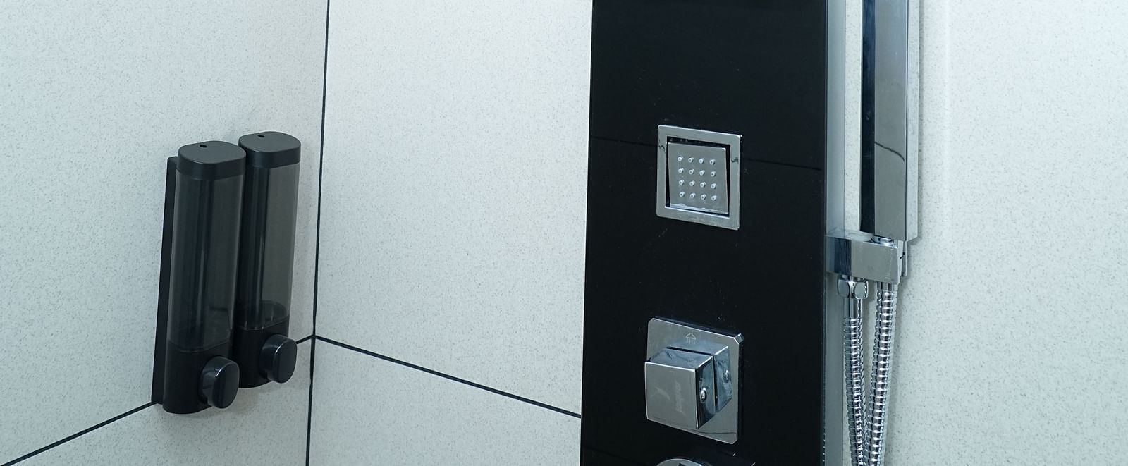 close up image of a standing shower with a modern look and a huge shower head