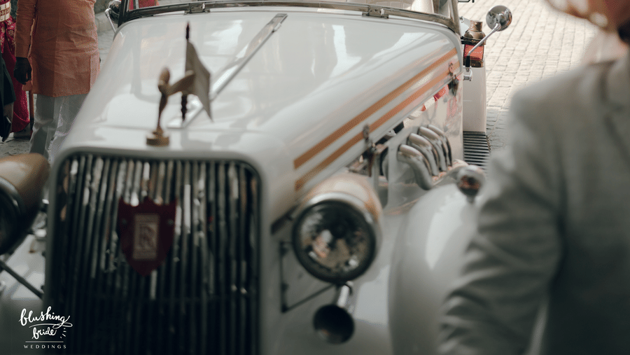 Entry of a wedding guests with groom on a vehicle and the background has some decorated umbrellas as one of the decorative elements in Marasa Sarovar Premiere, Bodhgaya.