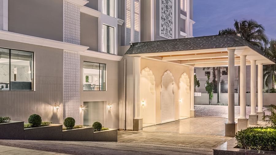 An image of the entrance to our hotel in Haridwar, showcasing elegant architecture with warm evening lighting - MJ Sarovar Portico, Haridwar