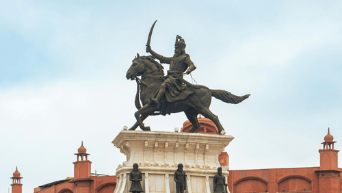 An image of the Statue of Maharaja Ranjit Singh at a roundabout in Amritsar seen on a cloudy day