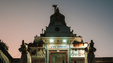 Exterior front view of Jagdish Temple, Udaipur steps leading up to the main shrine at dusk.