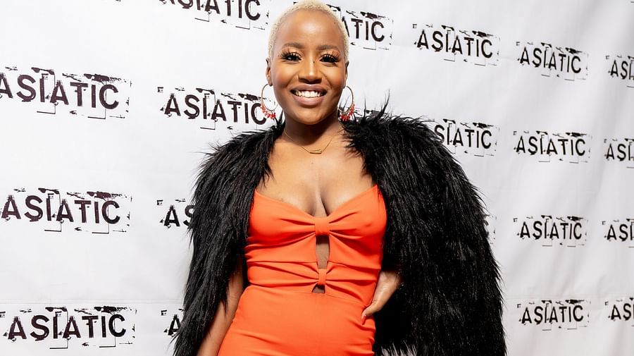 A woman posing for an event at Asiatic Lounge