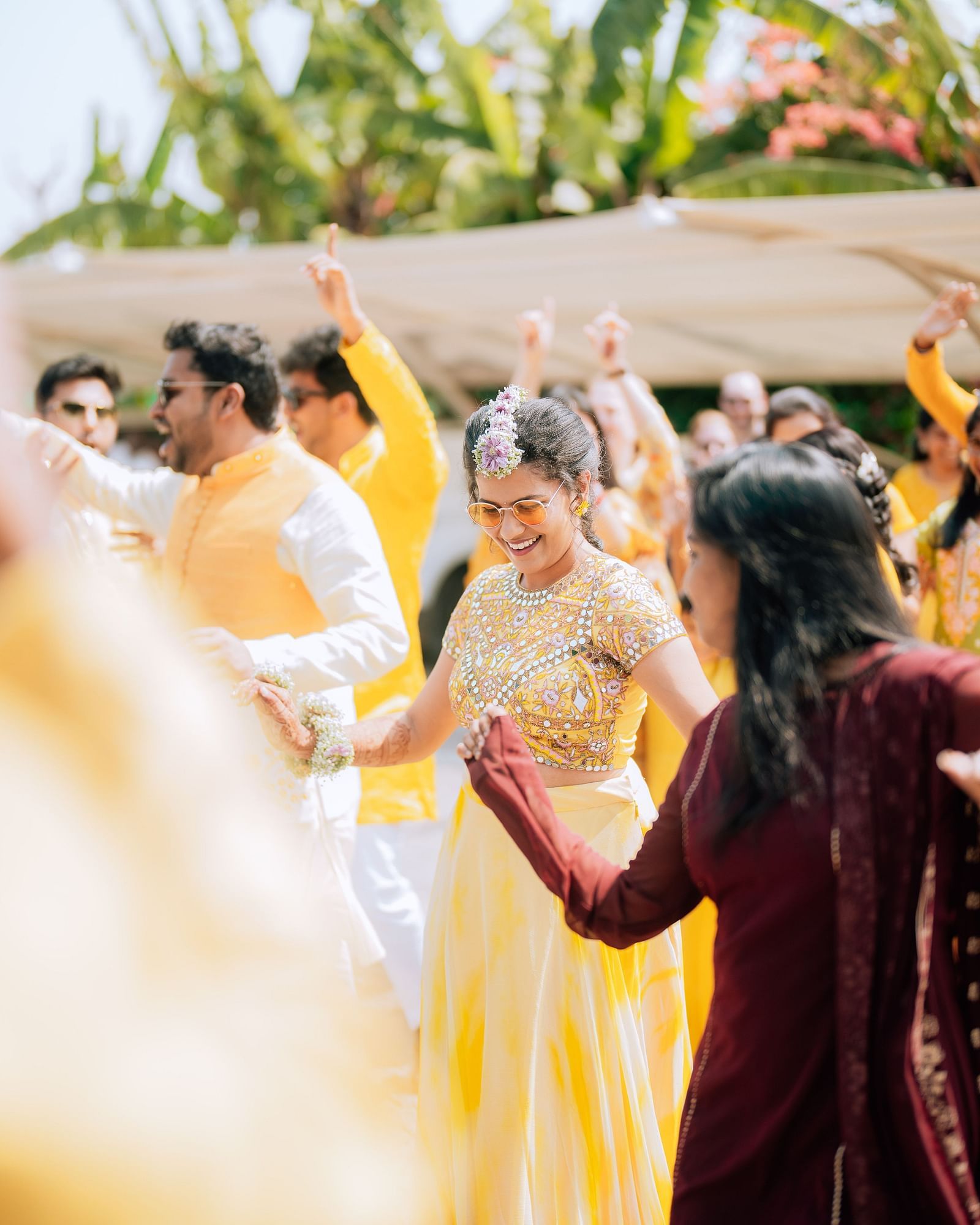 image of the bride dressed in a beautiful yellow gown dancing at darza resorts